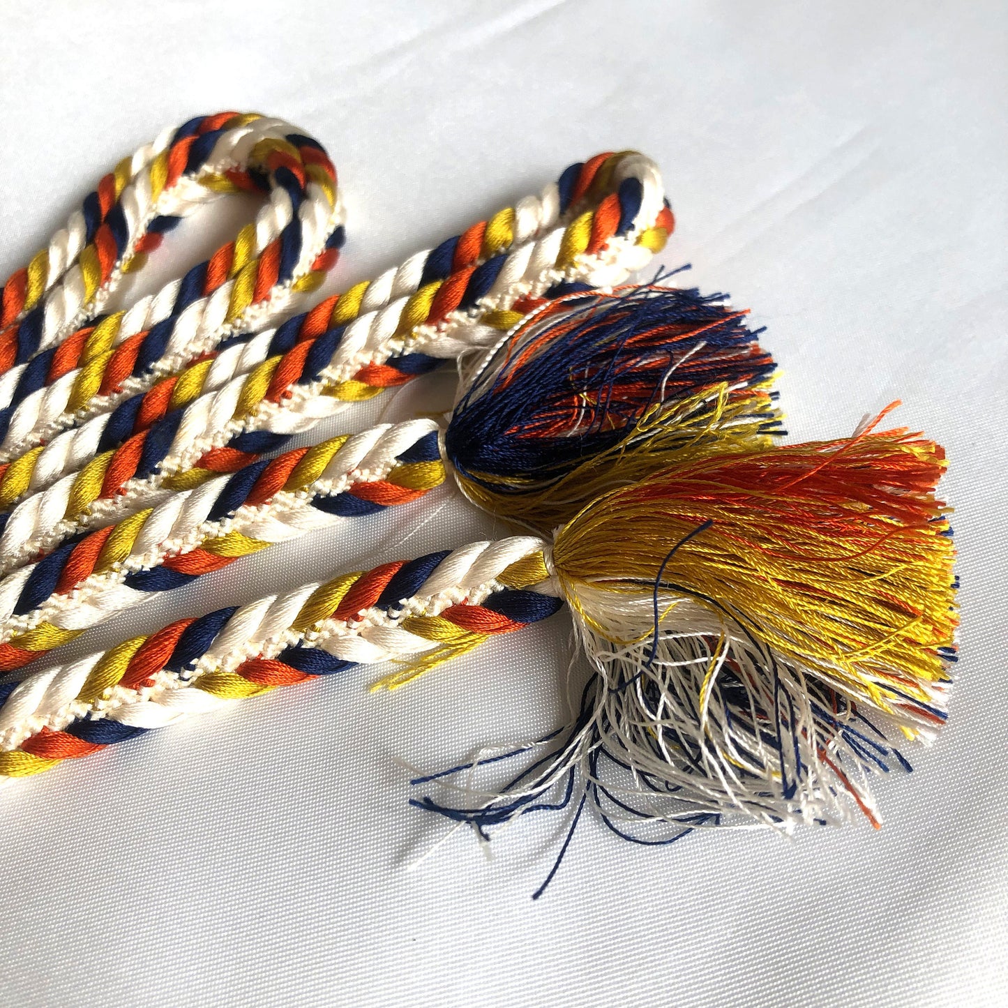 Vibrant silk obijime - thin belt with tassels - white, orange, navy, and yellow fishtail