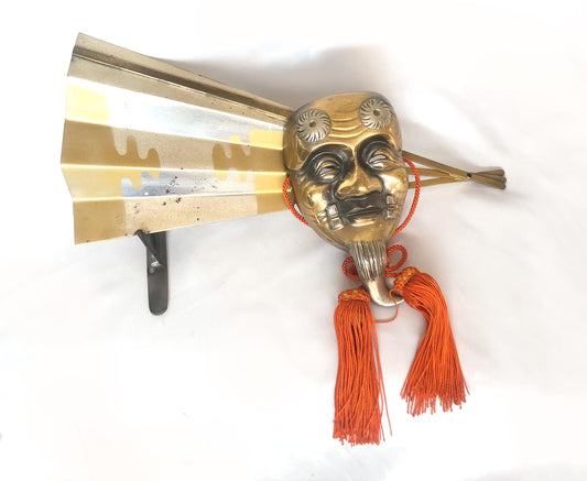 Japanese metal interior decoration - noh theater mask and a fan