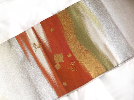 Elegant Nagoya obi - sparkling silver with orange accents and golden pine branches
