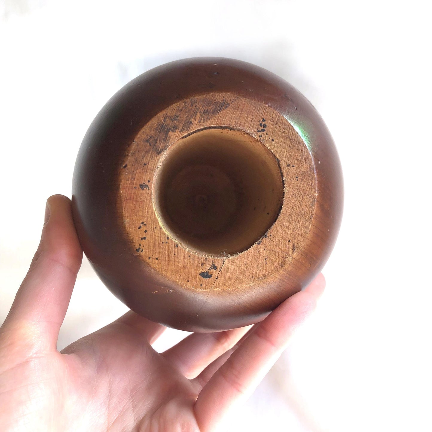 Pensive wooden Daruma figurine