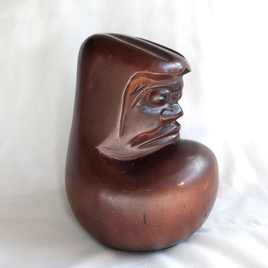 Pensive wooden Daruma figurine