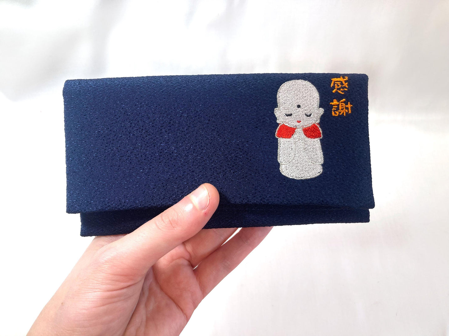 Small Japanese soft pouch / rosary bead cover - dark blue with an image of Jizo Bosatsu