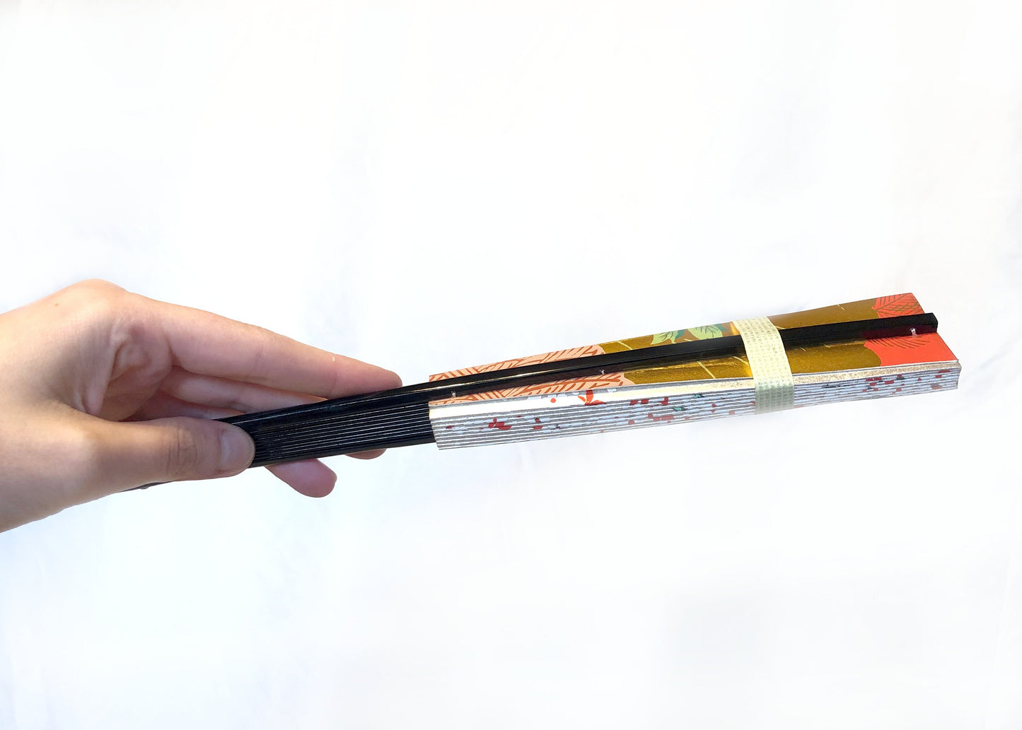 Decorative paper fan with a bamboo stand - different patterns available