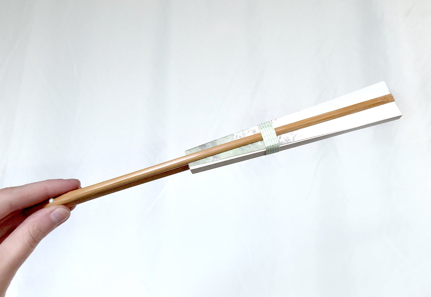 Decorative paper fan with a bamboo stand - different patterns available