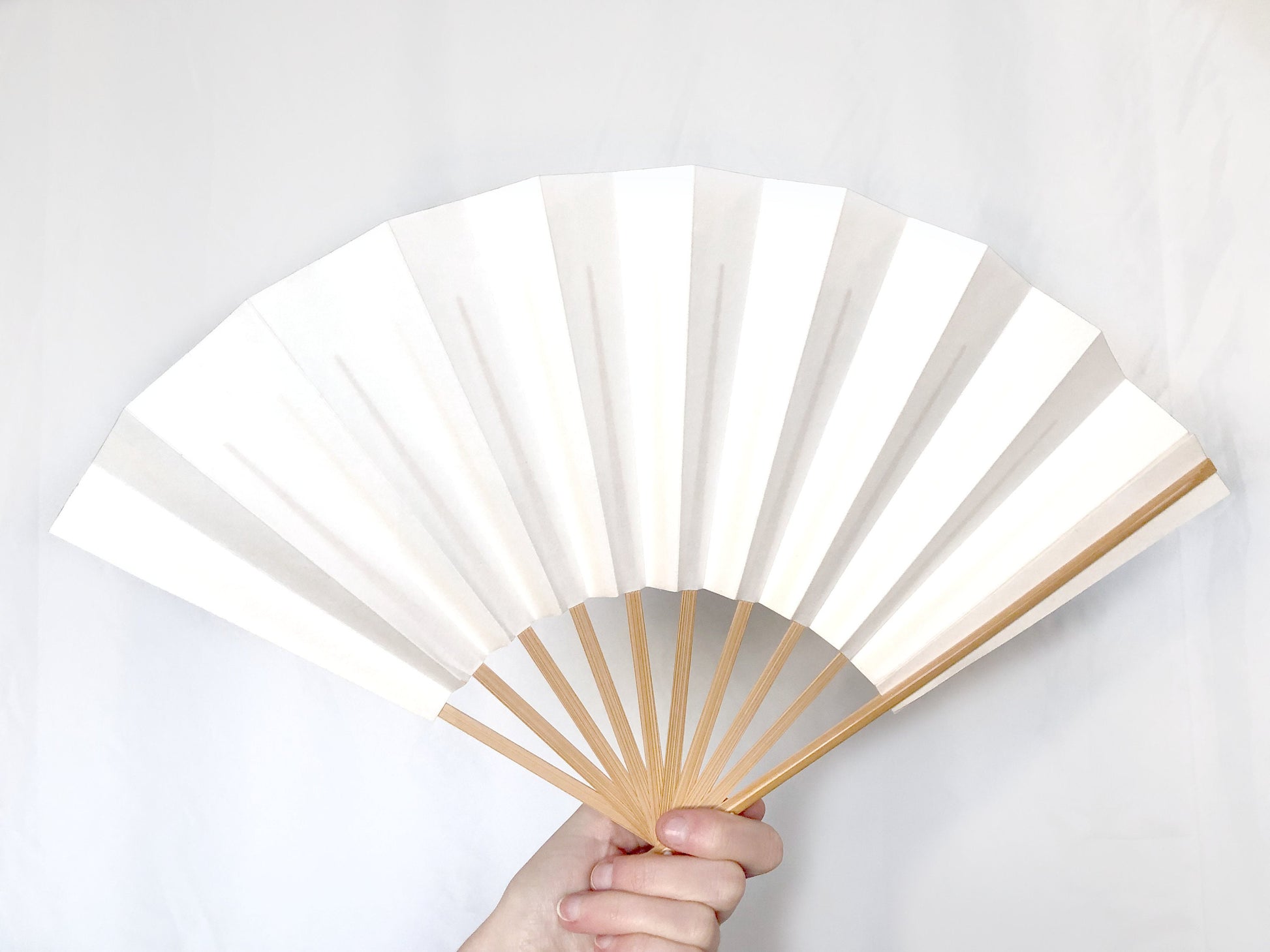 Decorative paper fan with a bamboo stand - different patterns available