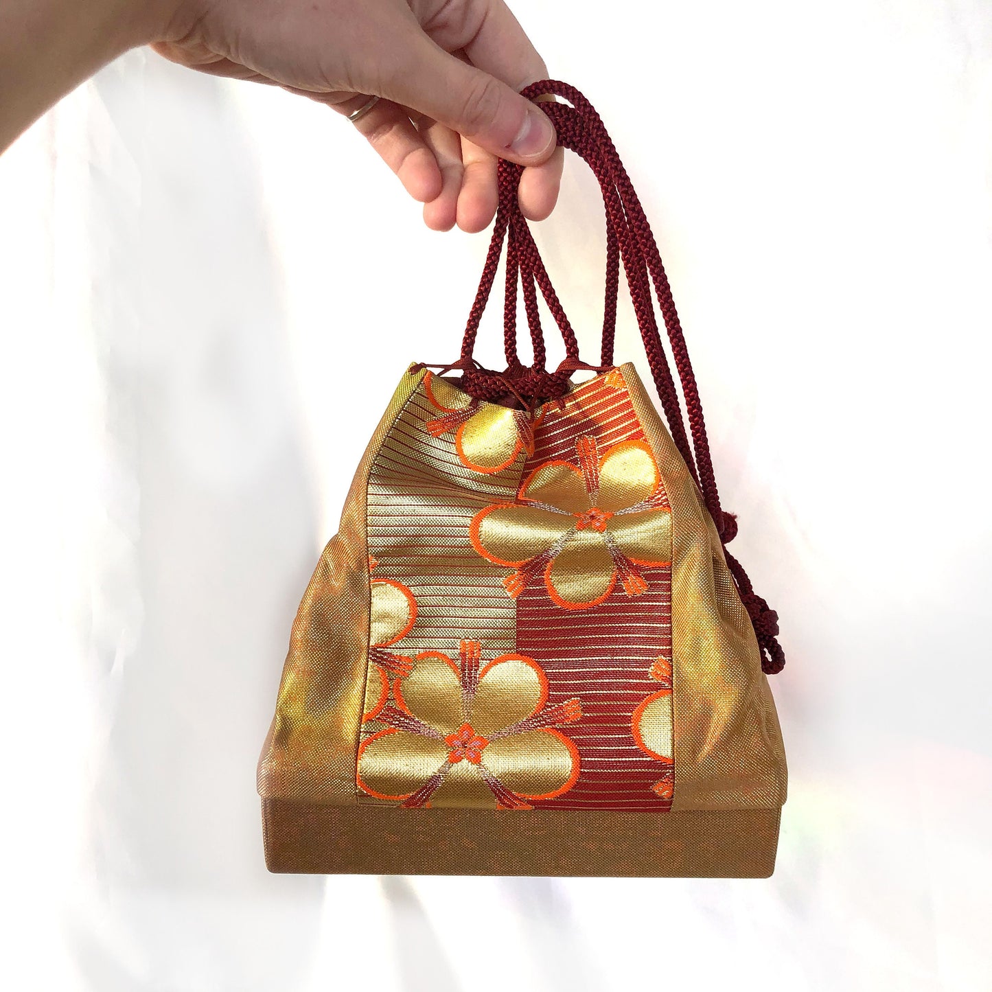 Elegant Japanese drawstring bag kinchaku - golden with floral accent