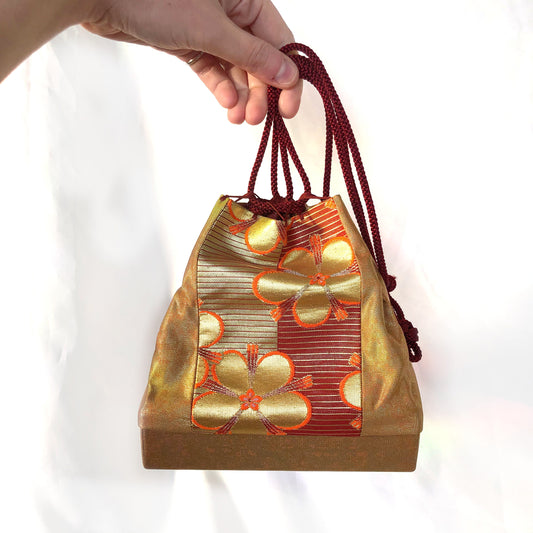 Elegant Japanese drawstring bag kinchaku - golden with floral accent