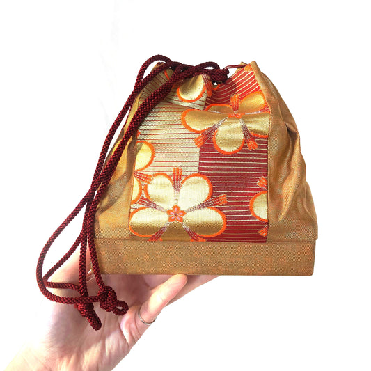 Elegant Japanese drawstring bag kinchaku - golden with floral accent