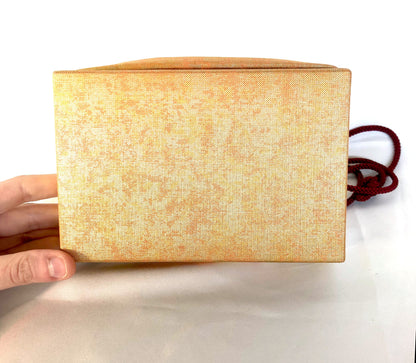 Elegant Japanese drawstring bag kinchaku - golden with floral accent