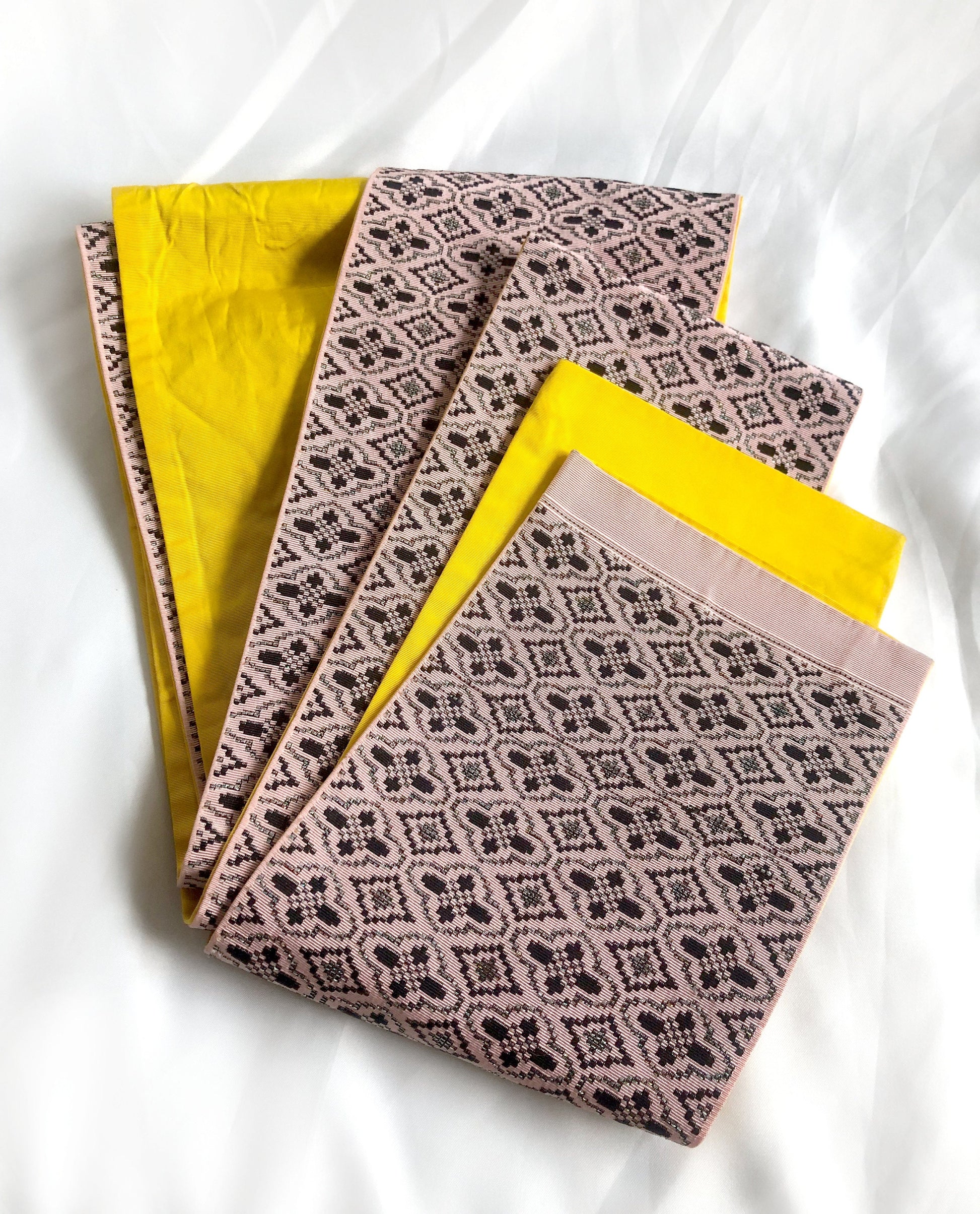 Vintage reversible Japanese hanhaba obi - light pink and yellow with black and metallic geometric pattern