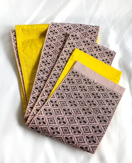 Vintage reversible Japanese hanhaba obi - light pink and yellow with black and metallic geometric pattern