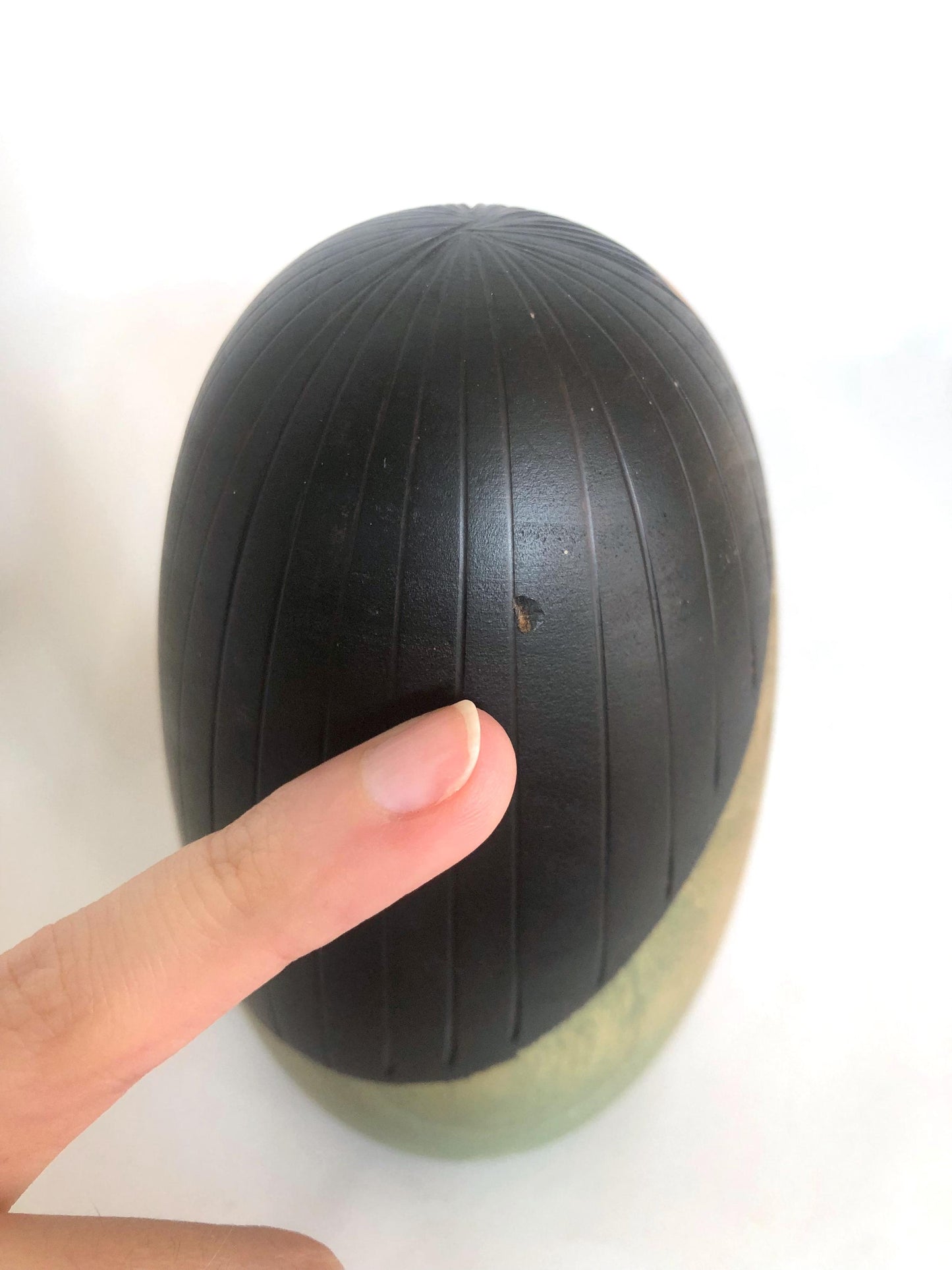 Cute wooden kokeshi doll with delicate flowers pattern by Usaburo