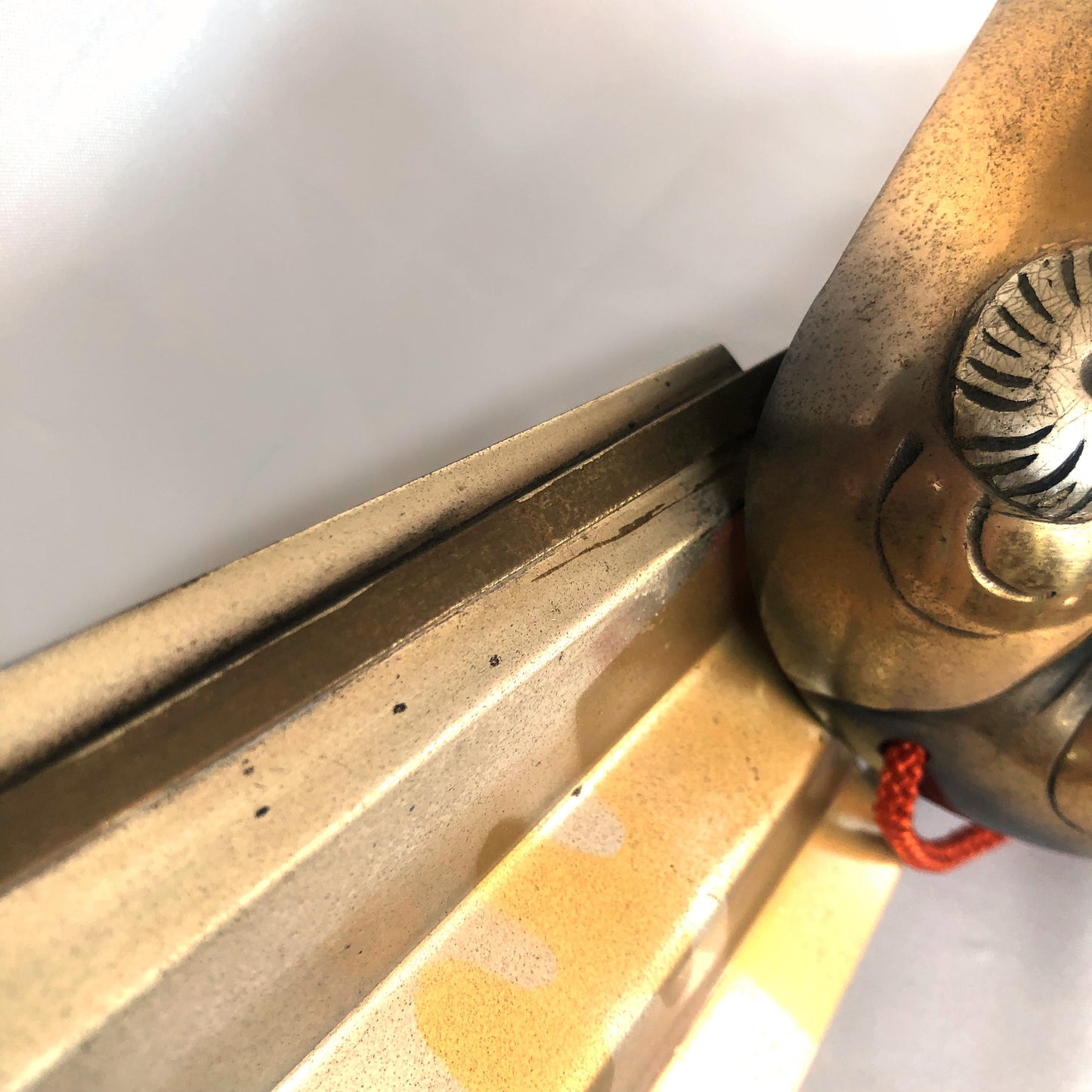 Japanese metal interior decoration - noh theater mask and a fan