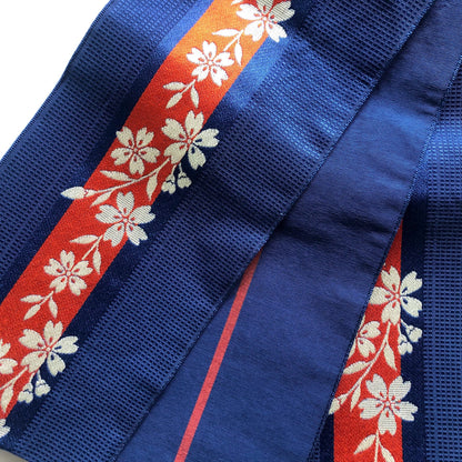 Reversible Japanese hanhaba obi - saturated blue with red stripe and cream sakura flowers