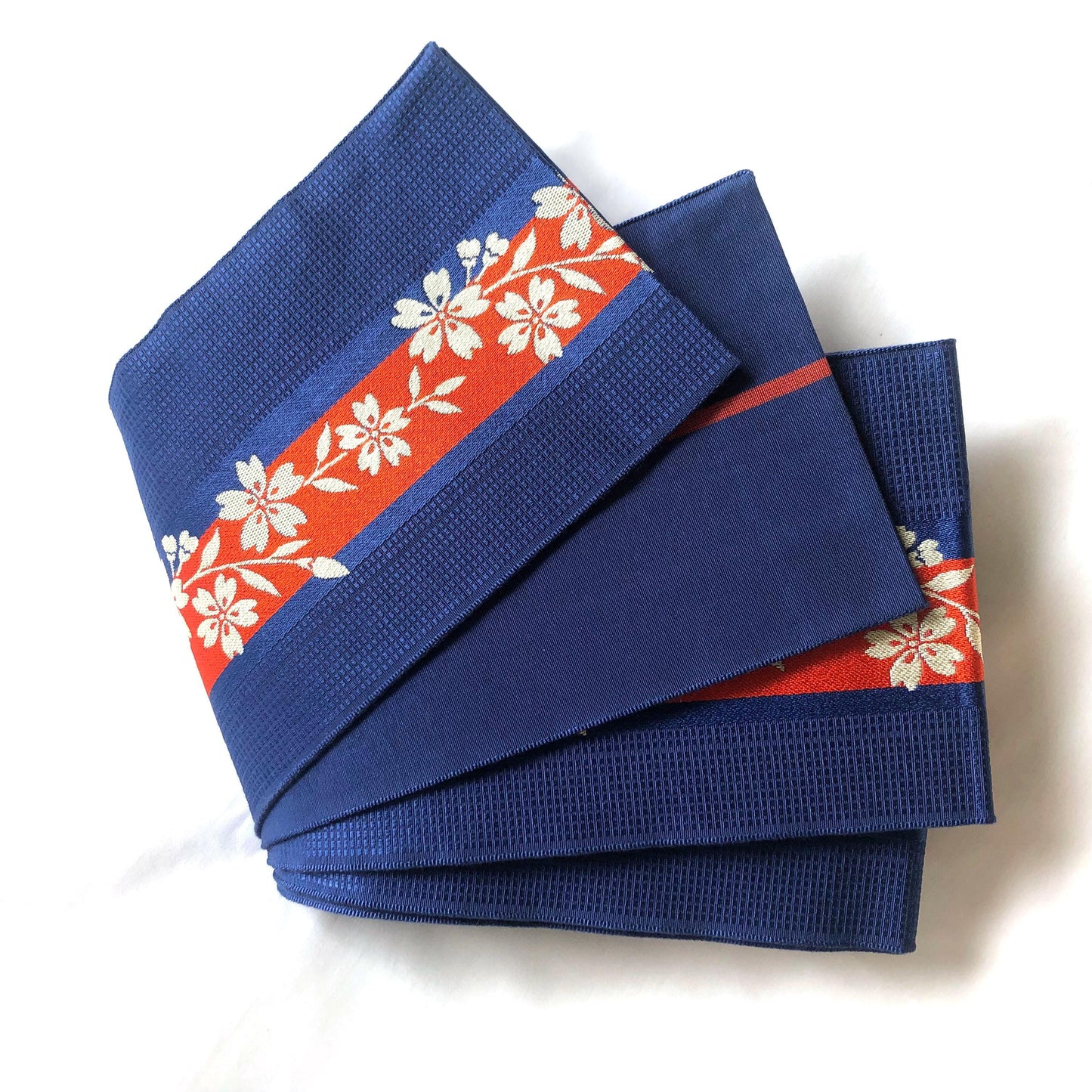 Reversible Japanese hanhaba obi - saturated blue with red stripe and cream sakura flowers