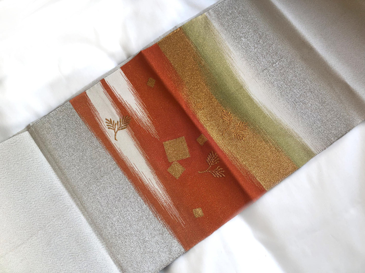 Elegant Nagoya obi - sparkling silver with orange accents and golden pine branches