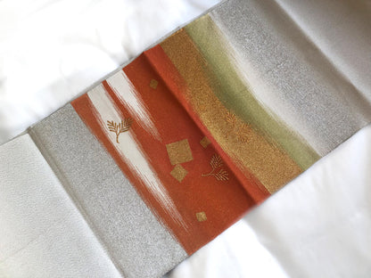Elegant Nagoya obi - sparkling silver with orange accents and golden pine branches