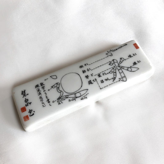 Japanese ceramic paperweight - calligraphy lesson