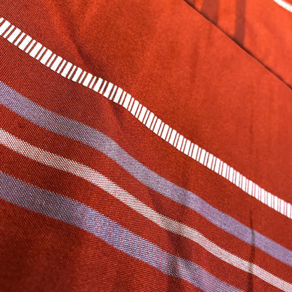 Casual Nagoya obi - terracota red with akabeko and miharu-koma pattern