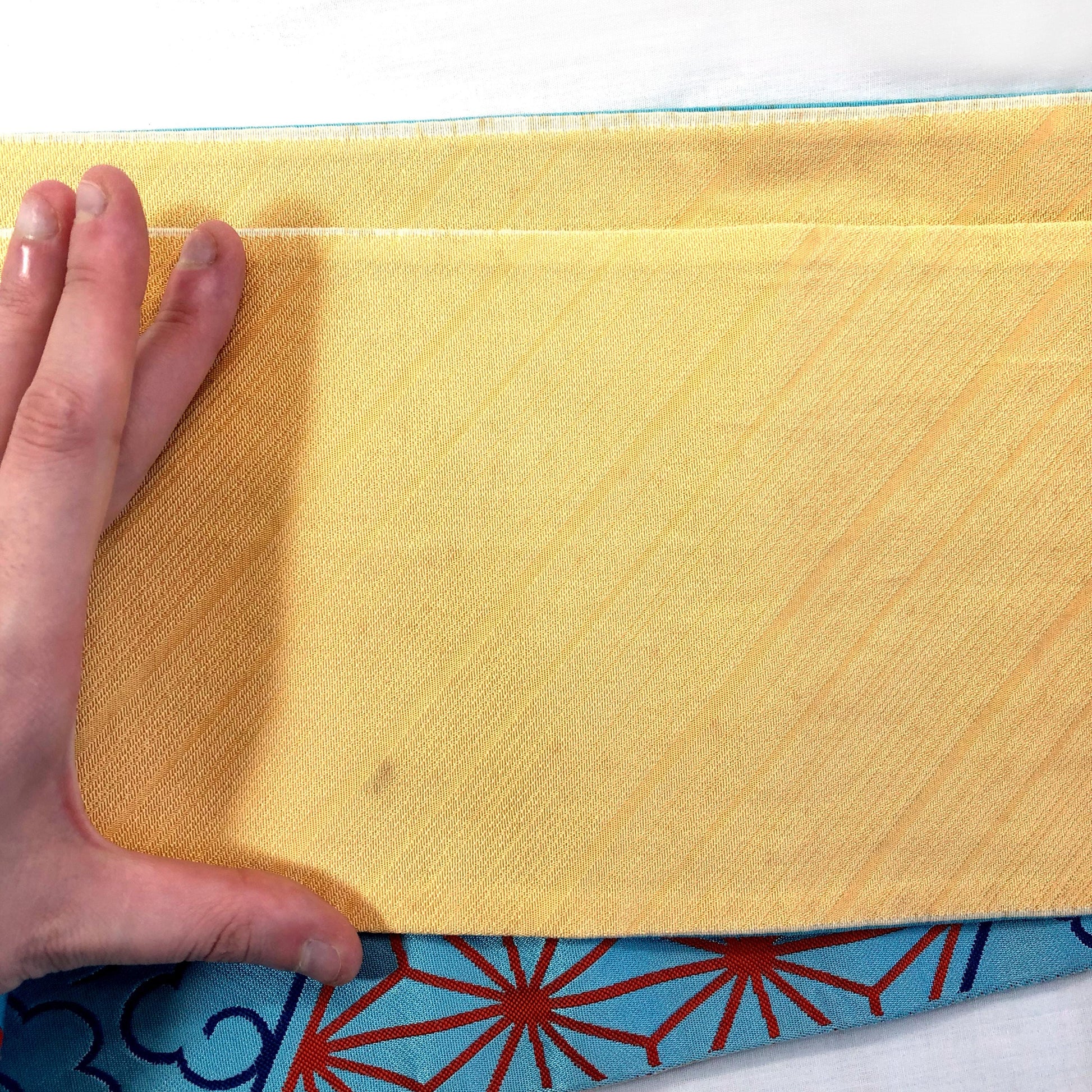 Reversible Japanese hanhaba obi - light blue and yellow with traditional red patterns (B grade)