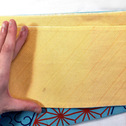 Reversible Japanese hanhaba obi - light blue and yellow with traditional red patterns (B grade)
