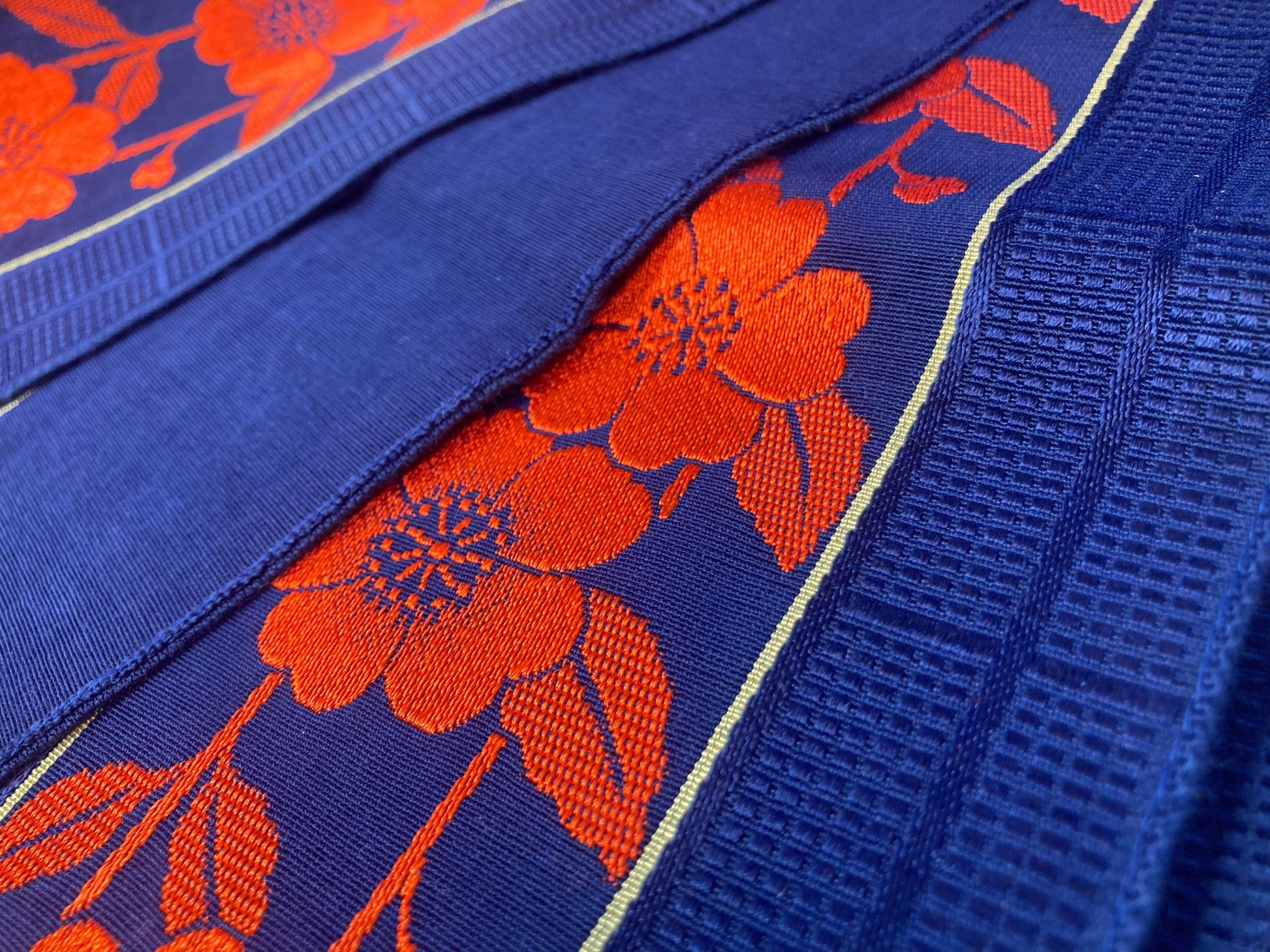 Reversible Japanese hanhaba obi - saturated blue with bright red flower stripe