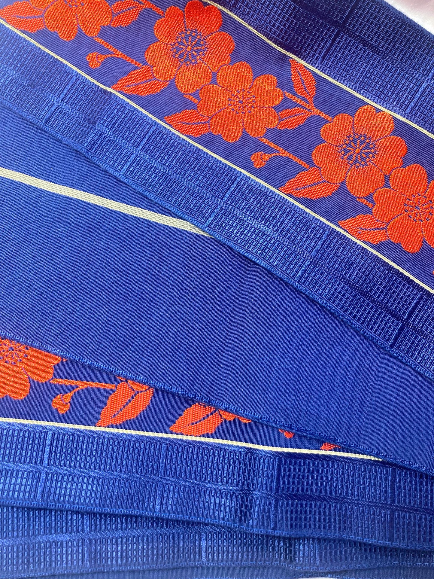 Reversible Japanese hanhaba obi - saturated blue with bright red flower stripe