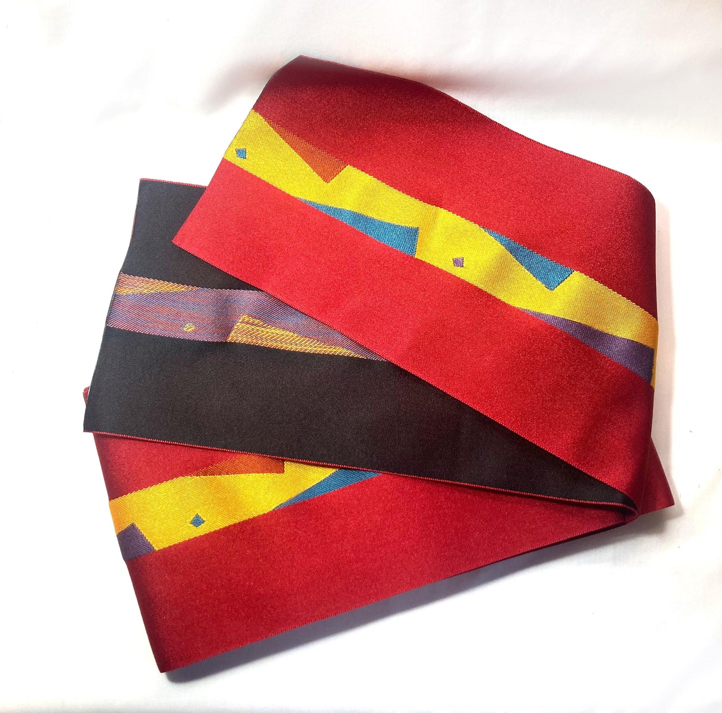 Reversible Japanese hanhaba obi - red and black with a geometric pattern