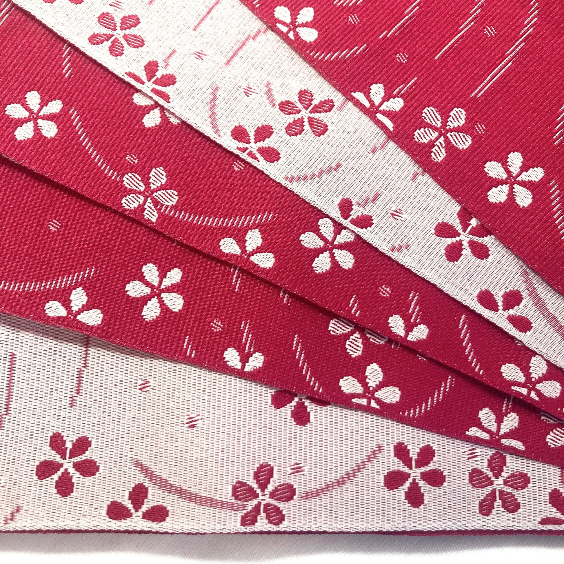 Simple Japanese hanhaba obi - two shades of pink with flowers over water
