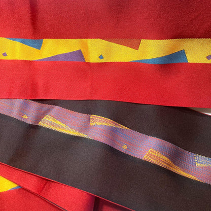 Reversible Japanese hanhaba obi - red and black with a geometric pattern
