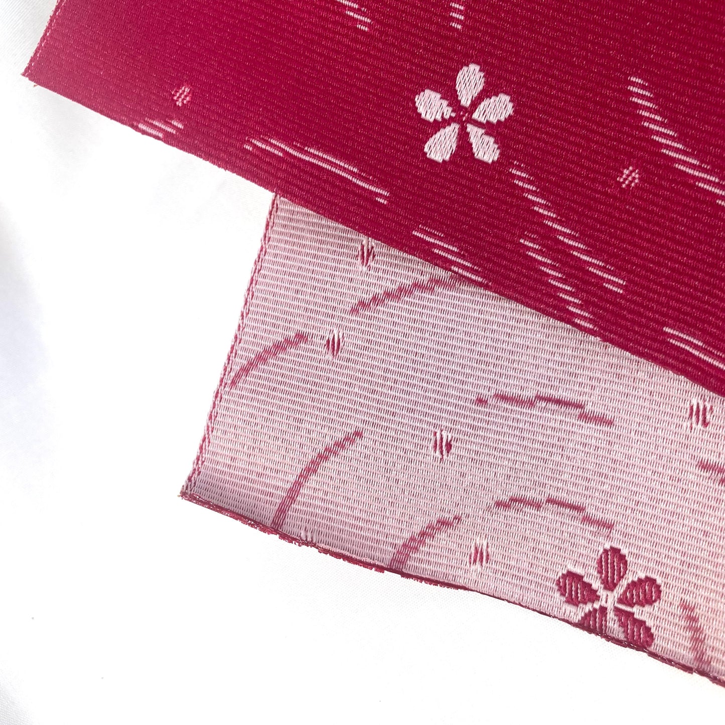 Simple Japanese hanhaba obi - two shades of pink with flowers over water