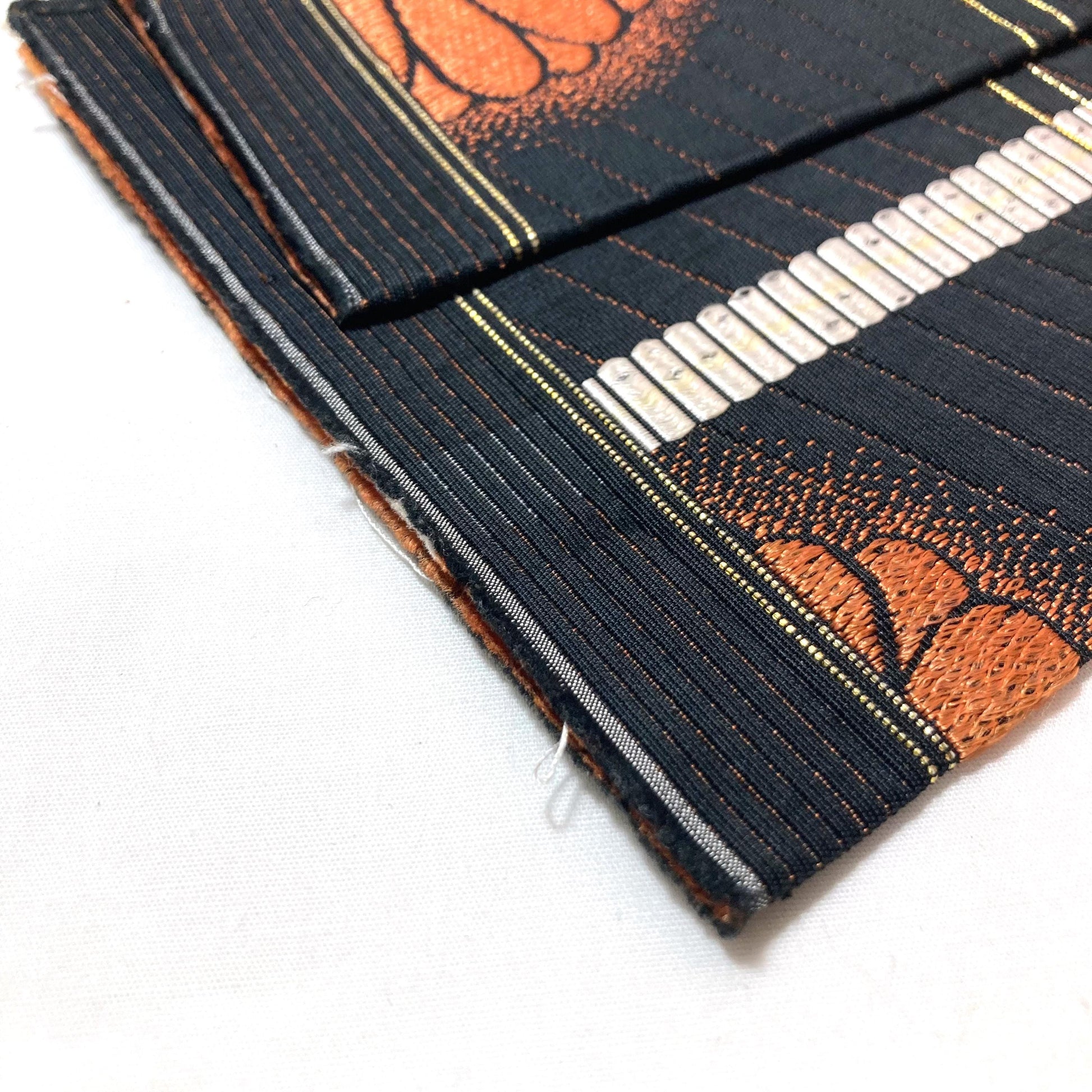 Reversible Japanese hanhaba obi - black with copper chrysanthemum flowers