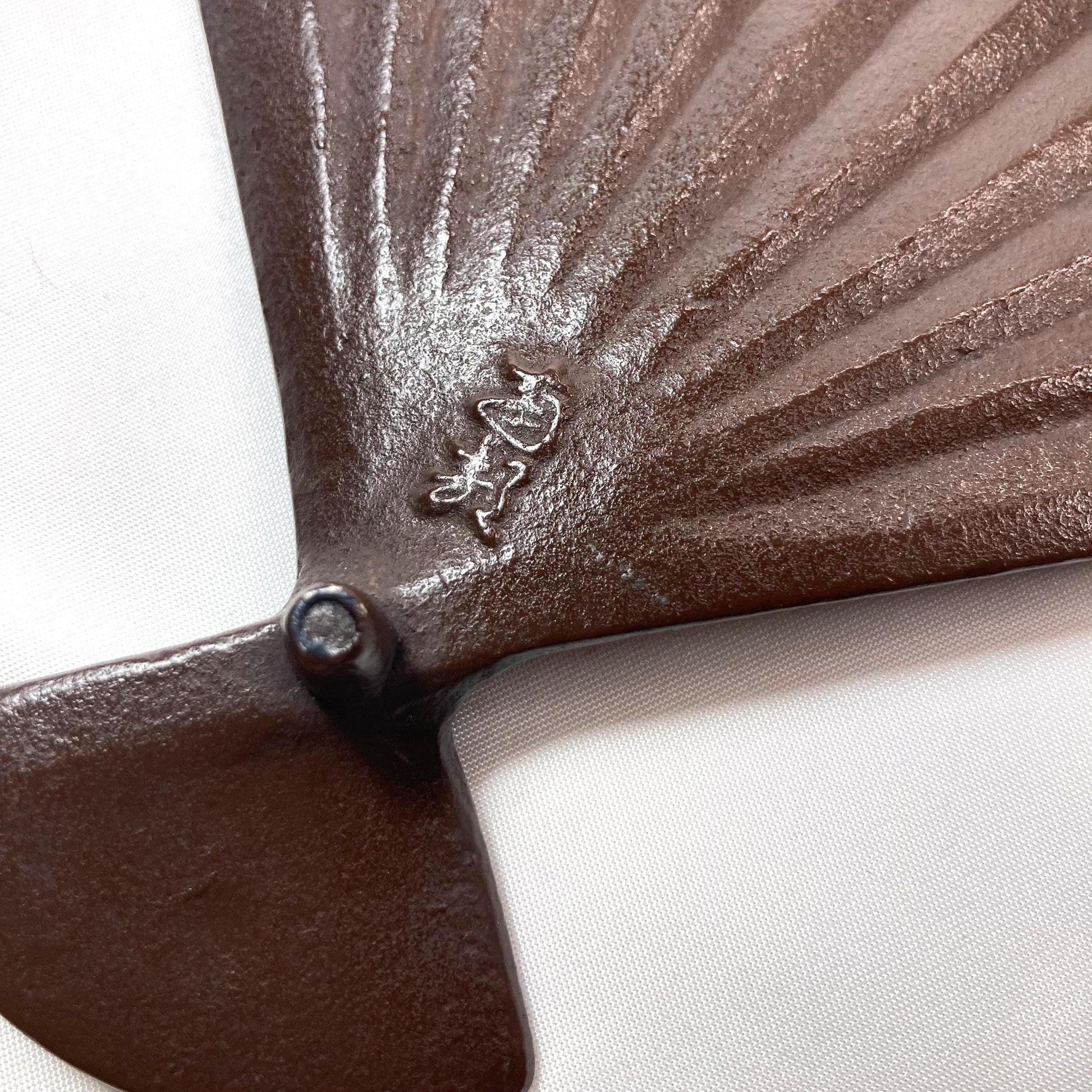 Japanese cast iron coaster / teapot holder / nabeoki - hand fan