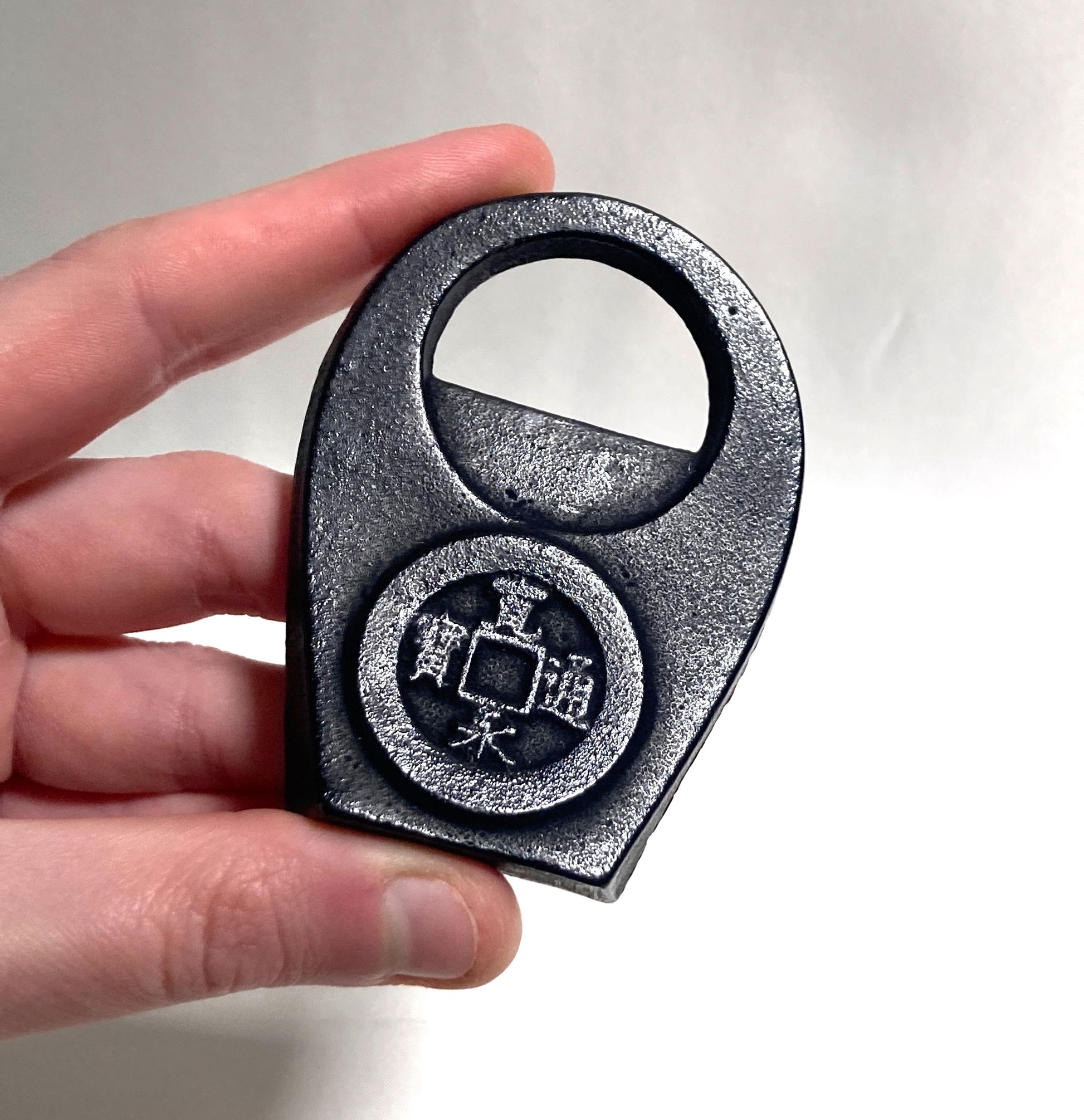 Japanese cast iron bottle opener - lucky coin
