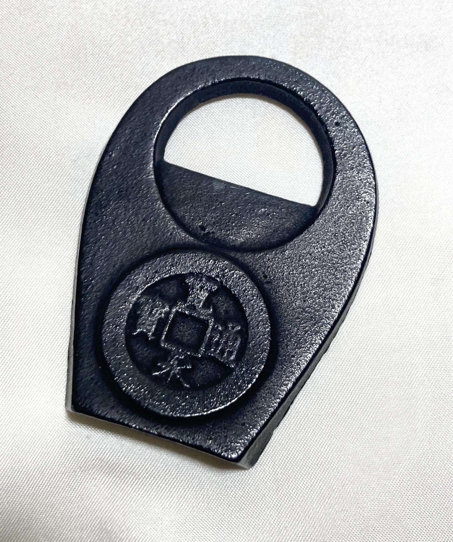 Japanese cast iron bottle opener - lucky coin