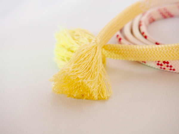 Pastel silk obijime - cream yellow with magenta accents