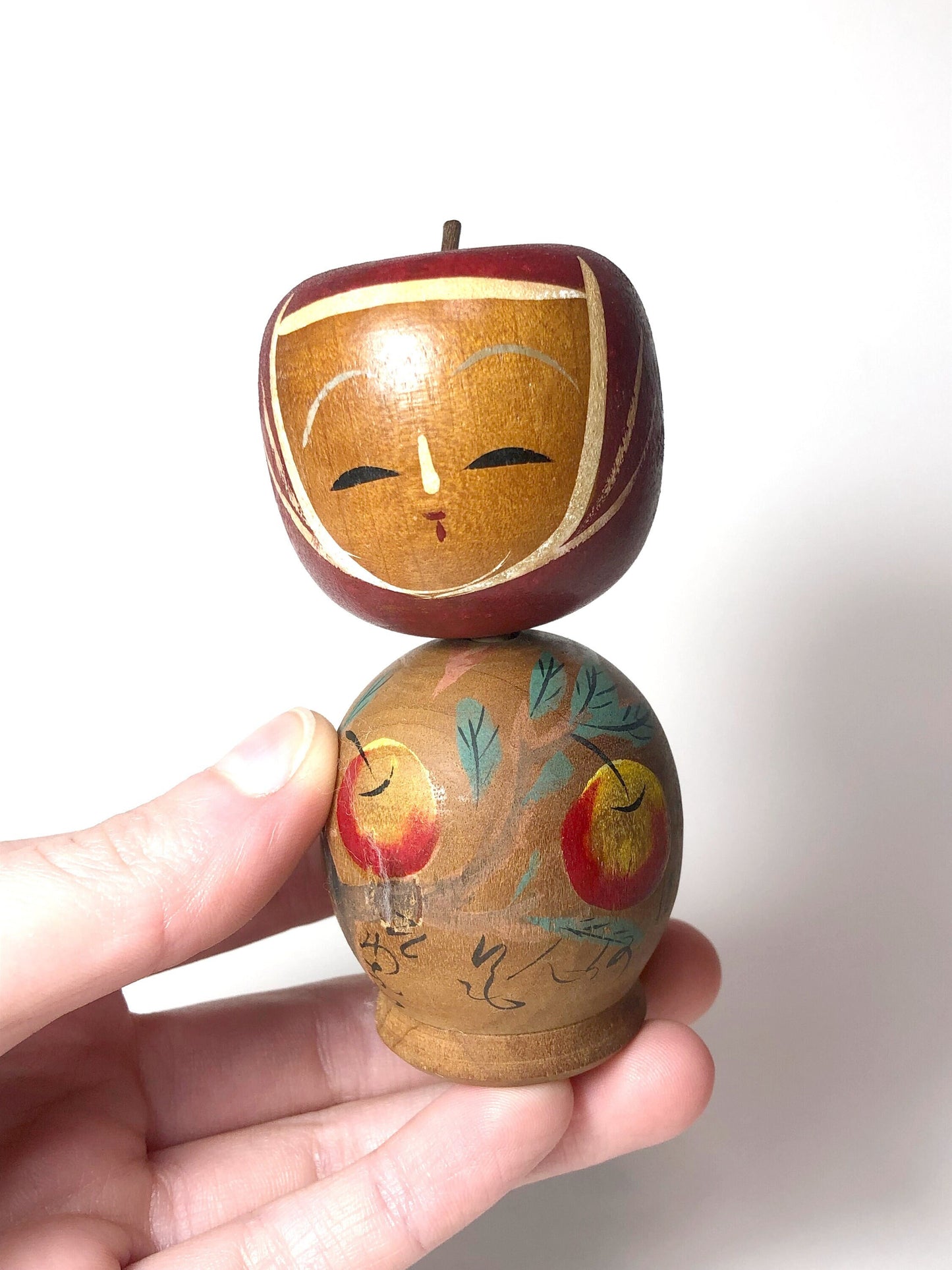 Vintage wooden kokeshi doll - apple picking girl