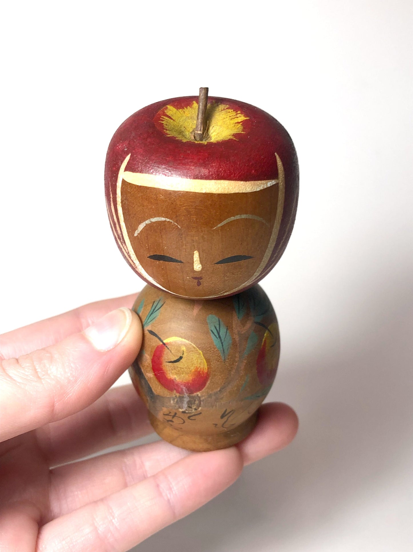 Vintage wooden kokeshi doll - apple picking girl